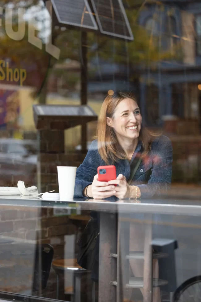 A real estate agent chatting with a local business in charming Cabbagetown café, Jet Fuel.